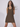 This image features a stylish olive green dress, perfect for sizes XS. The dress showcases a textured fabric, enhancing its visual appeal.